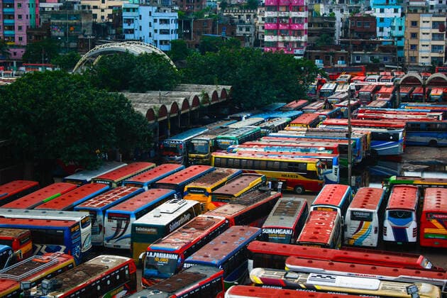 Bangladesh: Buses are not able to run on the road Due to the strict lockdown, no buses are able to run on inter-district routes. In this meantime bus worker s are passing their time by playing card and taking rest in Dhaka. Dhaka Bangladesh Saidabad Bus Stand Copyright: MdxIbrahim