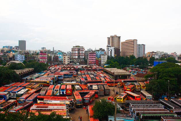 Bangladesh: Buses are not able to run on the road Due to the strict lockdown, no buses are able to run on inter-district routes. In this meantime bus worker s are passing their time by playing card and taking rest in Dhaka. Dhaka Bangladesh Saidabad Bus Stand Copyright: MdxIbrahim