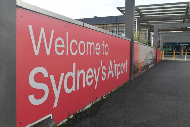 SYDNEY AIRPORT STOCK, The empty departures entrance is seen at Sydney Airport in Sydney, Tuesday, July 6, 2021. Sydney Airport?s biggest shareholder has tentatively backed delisting the company from the stock exchange, after superannuation giants sought to capitalise on the crisis in aviation through a non-binding $22 billion takeover bid. ( NO ARCHIVING, EDITORIAL USE ONLY, NO USE IN BOOKS WITHOUT CONSENT SYDNEY NSW AUSTRALIA  Copyright: xMICKxTSIKASx 20210706001555138934