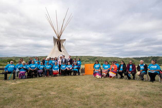 July 6, 2021, Cowessess First Nation, SK, Canada: Prime Minister Justin Trudeau, Chief Cadmus Delorme and Saskatchewan Premier Scott Moe stand for a photograph with residential school survivors following a ceremony at the site of a former residential school where, last month, ground-penetrating radar detected a potential 751 unmarked graves, in Cowessess First Nation, Sask., Tuesday, July 6, 2021. Cowessess First Nation Canada - ZUMAc35_ 20210706_zaf_c35_083 Copyright: xLiamxRichardsx