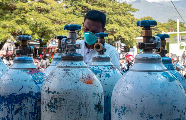 Increased Oxygen Usage Officers check oxygen-filled cylinders before being distributed to Covid-19 patient rooms at the Covid-19 referral hospital in Palu, Central Sulawesi, Indonesia, Wednesday 7 July 2021. The use of oxygen has increased along with the increase in Covid-19 patients being treated at this hospital. Although the number of patients infected with Covid-19 has increased in Palu, the availability of oxygen is sufficient and there is no shortage.  Copyright: xOpanxBustanx xOpnxImagesx