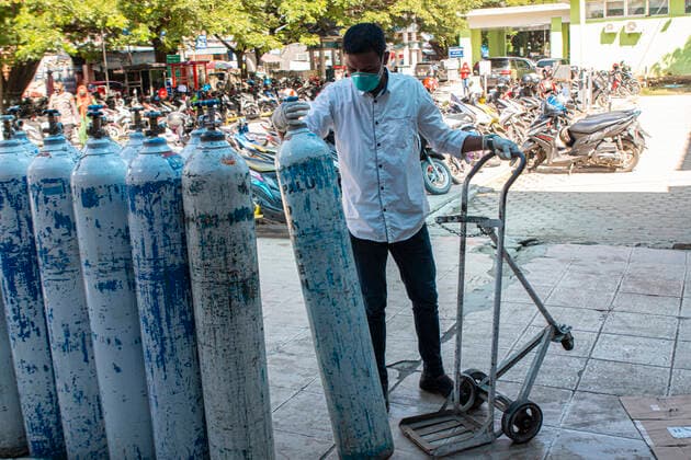 Increased Oxygen Usage Officers check oxygen-filled cylinders before being distributed to Covid-19 patient rooms at the Covid-19 referral hospital in Palu, Central Sulawesi, Indonesia, Wednesday 7 July 2021. The use of oxygen has increased along with the increase in Covid-19 patients being treated at this hospital. Although the number of patients infected with Covid-19 has increased in Palu, the availability of oxygen is sufficient and there is no shortage.  Copyright: xOpanxBustanx xOpnxImagesx