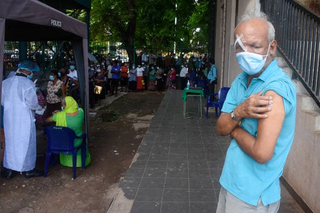 Coronavirus Emergency In Sri Lanka Sri Lankan senior citizen holds his arm received the first dose are given Pfizer-BioNTech vaccine as the second dose in vaccination center near Colombo on July 7, 2021 Colombo Sri Lanka jayawardana-notitle210707_np2Dc  Copyright: xAkilaxJayawardanax