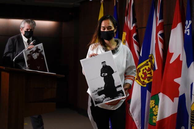 July 8, 2021, Ottawa, on, Canada: NDP MP Mumilaaq Qaqqaq holds a photo of Fr. Johannes Rivoire, who is wanted in Canada for abusing children in Nunavut but now resides in France, as NDP MP Charlie Angus holds a photo of Fr. Arthur Lavoie, who died in 1991 and was named in over 300 reports of physical and sexual abuse, as they arrive for a news conference calling on Minister of Justice David Lametti to investigate crimes against Indigenous people in Canada at residential schools, on Parliament Hill in Ottawa, on Thursday, July 8, 2021. Ottawa Canada - ZUMAc35_ 20210708_zaf_c35_008 Copyright: xJustinxTangx
