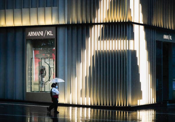 July 8, 2021, Kuala Lumpur, Malaysia: Pedestrians with an umbrella, walk past a closed shop during heavy downpour in downtown. Kuala Lumpur Malaysia - ZUMAs197 20210708_zaa_s197_068 Copyright: xWongxFokxLoyx
