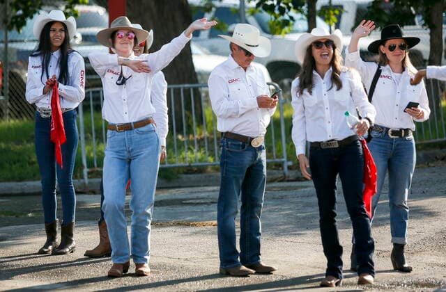 July 9, 2021, Calgary, ab, Canada: Stampede employees dance and cheer during the Calgary Stampede parade in Calgary, Alta., Friday, July 9, 2021. Calgary Canada  - ZUMAc35_ 20210709_zaf_c35_019 Copyright: xJeffxMcintoshx