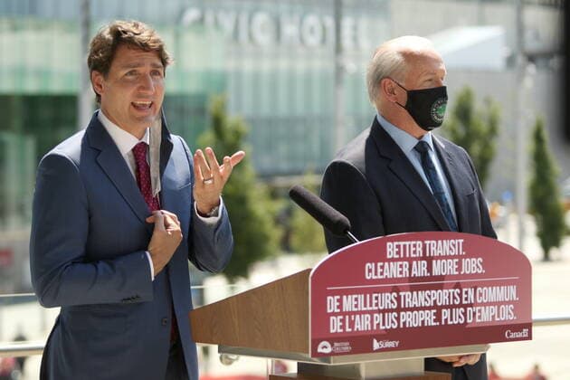 July 9, 2021, Surrey, BC, Canada: Prime Minister Justin Trudeau and Premier John Horgan take answer questions following a transit announcement during a press conference at Surrey City Hall in Surrey, B.C., on Friday, July 9, 2021. Surrey Canada  - ZUMAc35_ 20210709_zaf_c35_036 Copyright: xChadxHipolitox