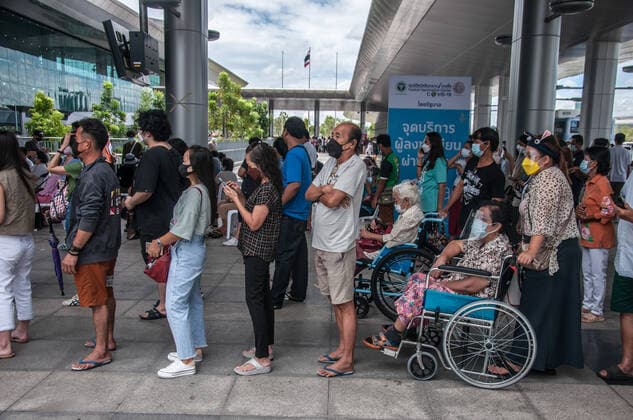 July 11, 2021, Bangkok, Thailand: People wait to be vaccinated with AstraZeneca vaccine outside Bang Sue Grand Station during a vaccination against COVID-19 at Bang Sue Grand Station in Bangkok. .Thailand has a record high of 86 new Covid-19 fatalities and 9,539 new cases over the past 24 hours, the Public Health Ministry reported. Bangkok Thailand - ZUMAs197 20210711_zaa_s197_072 Copyright: xPeeraponxBoonyakiatx