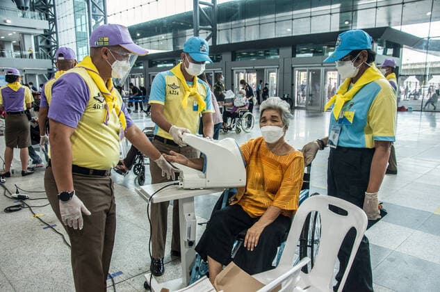 July 11, 2021, Bangkok, Thailand: An elderly woman checks her blood pressure before receiving a shot of AstraZeneca during a vaccination against COVID-19 at Bang Sue Grand Station in Bangkok. .Thailand has a record high of 86 new Covid-19 fatalities and 9,539 new cases over the past 24 hours, the Public Health Ministry reported. Bangkok Thailand - ZUMAs197 20210711_zaa_s197_077 Copyright: xPeeraponxBoonyakiatx