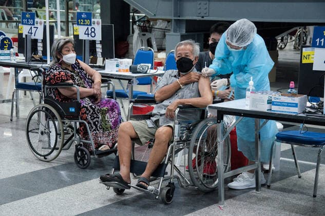 July 11, 2021, Bangkok, Thailand: A health worker administers a dose of AstraZeneca vaccine to an elderly man during a vaccination against COVID-19 at Bang Sue Grand Station in Bangkok. .Thailand has a record high of 86 new Covid-19 fatalities and 9,539 new cases over the past 24 hours, the Public Health Ministry reported. Bangkok Thailand - ZUMAs197 20210711_zaa_s197_090 Copyright: xPeeraponxBoonyakiatx