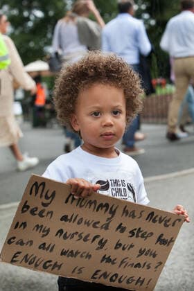 July 11, 2021, London, United Kingdom: A kid holds a placard outside Centre Court during the demonstration..Demonstrators protest outside Wimbledon tennis tournament on Men s Finals Day as they call for freedom of choice, medical freedom with no Covid checks necessary to gain access to major sporting events and no vaccine passports. London United Kingdom - ZUMAs197 20210711_zaa_s197_140 Copyright: xMartinxPopex