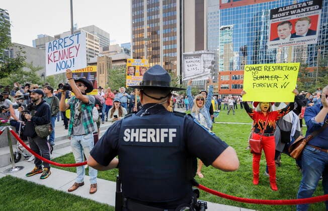 July 12, 2021, Calgary, ab, Canada: Protesters shout slogans as Alberta Premier Jason Kenney hosts the Premier s annual Stampede breakfast in Calgary, Alta., Monday, July 12, 2021. Calgary Canada  - ZUMAc35_ 20210712_zaf_c35_016 Copyright: xJeffxMcintoshx