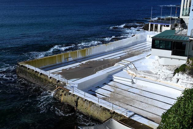 NSW CORONAVIRUS COVID19, The pools at Bondi Icebergs remain empty at Bondi Beach in Sydney, Thursday, July 15, 2021. New South Wales has recorded 65 new locally transmitted coronavirus cases overnight, 28 of which were infectious during their time in the community. ( NO ARCHIVING, EDITORIAL USE ONLY, NO USE IN BOOKS WITHOUT CONSENT SYDNEY NSW AUSTRALIA  Copyright: xBIANCAxDExMARCHIx 20210715001557395925