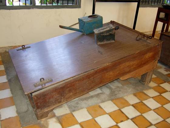 Evidence of torture at Tuol Sleng (S 21) Prison: Khmer Rouge water-boarding equipment. Victims were shackled to the apparatus with their heads pointing downwards. The watering can was used to induce a sensation of drowning.<br ><br > The Tuol Sleng Genocide Museum is a museum in Phnom Penh, the capital of Cambodia. The site is a former high school which was used as the notorious Security Prison 21 (S-21) by the Khmer Rouge communist regime from its rise to power in 1975 to its fall in 1979. Tuol Sleng means Hill of the Poisonous Trees or Strychnine Hill . Cambodia: Tuol Sleng (S 21) Prison: Khmer Rouge water-boarding equipment. xSupplier:xCPAxMediaxCo.xLtd.x Copyright: xx