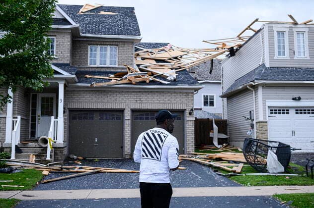 July 15, 2021, Barrie, on, Canada: A resident surveys the damage left after a tornado touched down in his neighbourhood, in Barrie, Ont., on Thursday, July 15, 2021. Barrie Canada  - ZUMAc35_ 20210715_zaf_c35_101 Copyright: xChristopherxKatsarovx