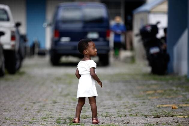 July 16, 2021, Tegucigalpa, Honduras: A girl walks through the facilities of the migration center. More than 120 migrants, mostly of Haitian origin and a smaller number of Cubans, arrived yesterday in the capital Tegucigalpa to continue their migratory journey to the United States. After entering Honduran territory, for a few hours they stopped their march at one of the offices of the National Migration Institute (INM) where they were issued a safe-conduct to be able to transit through Honduras. Tegucigalpa Honduras - ZUMAf149 20210716_zip_f149_008 Copyright: xMiloxEspinozax