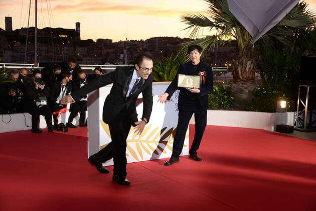 July 17, 2021, CANNES, France: CANNES, FRANCE - JULY 17: Ron Mael and Russell Mael pose with the Best Director Award in the name of Leos Carax for Annette during the 74th annual Cannes Film Festival on July 17, 2021 in Cannes, France CANNES France - ZUMAi09_ 20210717_zaf_i09_020 Copyright: xFrederickxInjimbertx