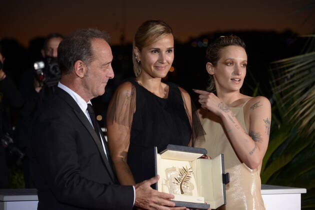 July 17, 2021, CANNES, France: CANNES, FRANCE - JULY 17: Vincent Lindon, Julia Ducournau and Agathe Rousselle pose with the Palme d Or Best Movie Award for Titane during the 74th annual Cannes Film Festival on July 17, 2021 in Cannes, France. CANNES France - ZUMAi09_ 20210717_zaf_i09_042 Copyright: xFrederickxInjimbertx