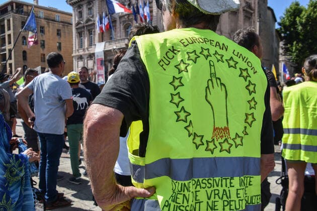 July 17, 2021, Marseille, France: (EDITOR S NOTE: Images contains profanity).A protesters is seen wearing a neon green vest with the words on the back reading Fuck European Union during the demonstration against the health pass in Marseille..More than 4,000 people in Marseille demonstrated against a health pass that French President Emmanuel Macron announced among the new anti-Covid 19 measures which will be necessary to be frequenting cafÃ terraces, restaurants, cinemas, theatres and other culture and leisure activities to help contain the spread of the Covid-19 virus. Marseille France - ZUMAs197 20210717_zaa_s197_459 Copyright: xGerardxBottinox