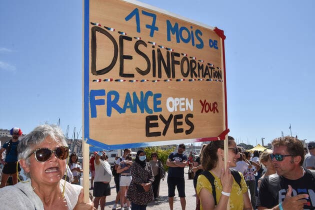 July 17, 2021, Marseille, France: Protesters hold a placard during the demonstration against the health pass in Marseille..More than 4,000 people in Marseille demonstrated against a health pass that French President Emmanuel Macron announced among the new anti-Covid 19 measures which will be necessary to be frequenting cafÃ terraces, restaurants, cinemas, theatres and other culture and leisure activities to help contain the spread of the Covid-19 virus. Marseille France - ZUMAs197 20210717_zaa_s197_462 Copyright: xGerardxBottinox