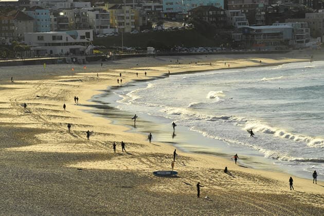 NSW CORONAVIRUS COVID19, Members of the public are seen exercising and surfing at Bondi Beach in Sydney, Monday, July 19, 2021. The stay-at-home orders for coronavirus-hit Greater Sydney and surrounds have been tightened with non-essential retail to close and all construction paused until July 30. ( NO ARCHIVING, EDITORIAL USE ONLY, NO USE IN BOOKS WITHOUT CONSENT SYDNEY NSW AUSTRALIA  Copyright: xMICKxTSIKASx 20210719001558377852