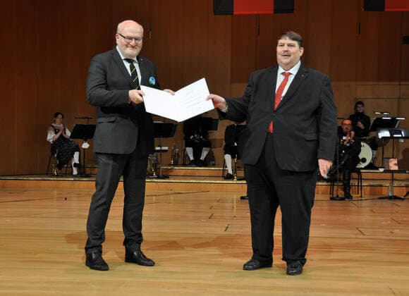 Former Czech culture minister Daniel Herman, left, received top Sudeten German award, the European Charles IV Prize, at the Sudeten German congress in Munich, Germany, on July 17, 2021, describing it in his speech as a gesture of support for building friendship between Germans and Czechs and removing mutual prejudices. Congratulations on his decoration were addressed to him not only by Sudeten German Landsmannschaft (SL) leader Bernd Posselt, right, who presented the prize to him, but also Bavarian Minister President Markus Soder. (CTKxPhoto AlesxZapotocky) CTKPhotoP2021071703632 