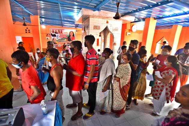 NEW DELHI, INDIA - JULY 18: People wait in queue to register for Covid-19 vaccine, during a vaccination drive at Satya Jeevan Leprosy Society in Lajpat Nagar, on July 18, 2021 in New Delhi, India. (Photo by Raj K Raj Hindustan Times) COVID-19 Vaccination Drive
