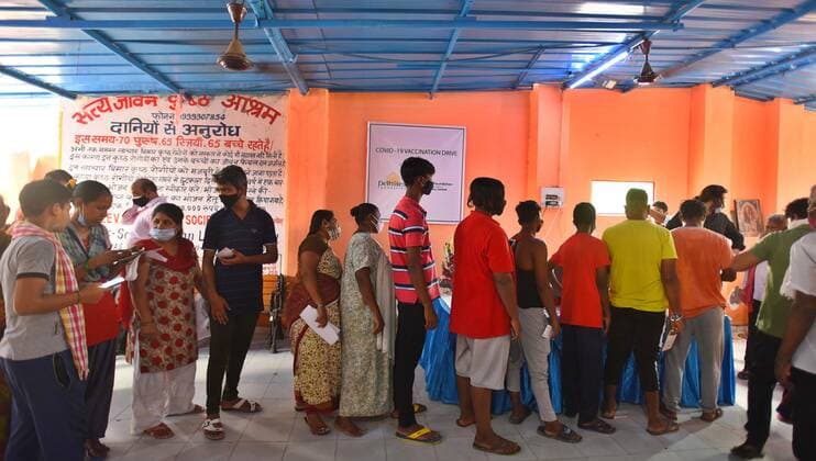 NEW DELHI, INDIA - JULY 18: People wait in queue to register for Covid-19 vaccine, during a vaccination drive at Satya Jeevan Leprosy Society in Lajpat Nagar, on July 18, 2021 in New Delhi, India. (Photo by Raj K Raj Hindustan Times) COVID-19 Vaccination Drive