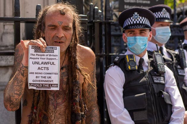 July 19, 2021, London, United Kingdom: A protester holds a placard next to police officers expressing his opinion during the demonstration..Thousands of people gathered near Parliament Square in a protest against health passports, protective masks, Covid-19 vaccines and lockdown restrictions. London United Kingdom - ZUMAs197 20210719_zaa_s197_050 Copyright: xPietroxRecchiax