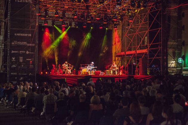 Italy: Zucchero Sugar Fornaciari live at Ferrara After yesterday s success on Sunday 18th July, Zucchero returned to the Ferrara Summer Festival stage again tonight Monday 19th July thus doubling his presence in Ferrara! Together with Zucchero Fornaciari, Doug and Kat also went on the stage of the Ferrara Summer Festival! Ferrara FE Italy piazza trento trieste Copyright: CarloxVergani