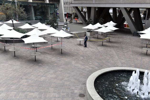 NSW CORONAVIRUS COVID19, An office worker walks in a deserted food square in the central business district in Sydney, Wednesday, July 21, 2021. The stay-at-home orders for coronavirus-hit Greater Sydney and surrounds have been tightened with non-essential retail to close and all construction paused until July 30. ( NO ARCHIVING, EDITORIAL USE ONLY, NO USE IN BOOKS WITHOUT CONSENT SYDNEY NSW AUSTRALIA  Copyright: xMICKxTSIKASx 20210721001558738964