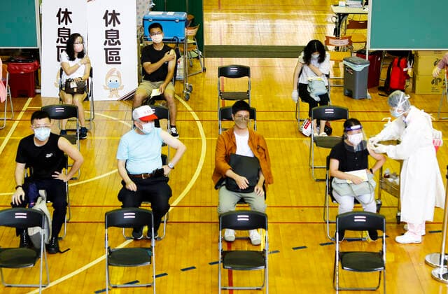 Coronavirus Vaccination In Taiwan People get inoculated with vaccines against the Coronavirus, at a site inside the National Taiwan University Hospital, as the island has seen a downward shift in the number of infections and deaths, in Taipei, Taiwan, 21 July 2021. Taiwan is discussing the possibility of easing more Covid restrictions as it supplies AstraZeneca, Moderna and Mediterranean vaccines to boost immunity rate, with travel and border restrictions remain effective. Taipei Taiwan ceng-notitle210721_npHhu  Copyright: xCengxShouxYix