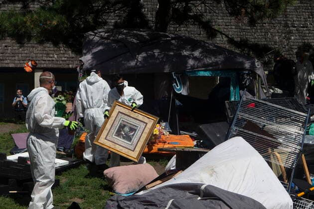 July 21, 2021, Toronto, on, Canada: City workers clear encampment resident s belongings after Toronto Police cleared the Lamport Stadium Park homeless encampment in Toronto on Wednesday, July 21, 2021. Toronto Canada  - ZUMAc35_ 20210721_zaf_c35_036 Copyright: xChrisxYoungx