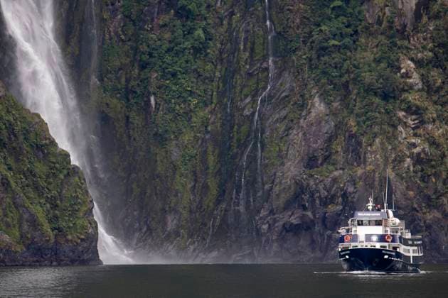 Milford Sound In Fiordland National Park, New Zealand A cruise ship passes the Bowen Falls in Milford Sound in the southwest of Fiordland National Park, New Zealand on July 22, 2021. Milford Sound is a UNESCO World Heritage Site in the south island in New Zealand. Te Anau New Zealand vidanagama-notitle210722_npVc2  Copyright: xSankaxVidanagamax