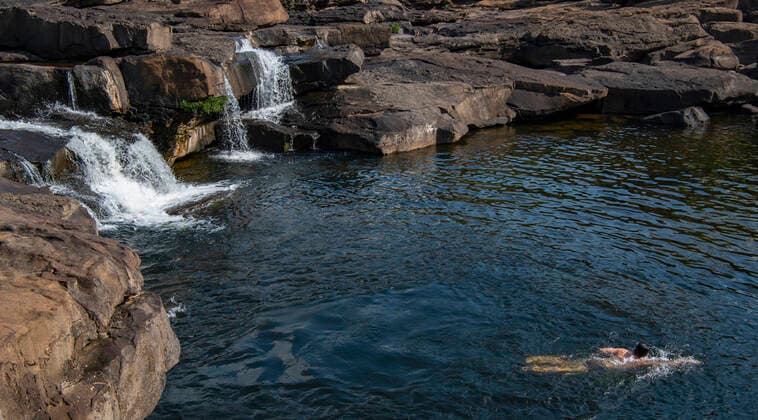 man swimming below the Tatai waterfall in Cambodia Tatai, Koh Kong Province, Cambodia CR_THHE210701E-786580-01 ,model released, Symbolfoto