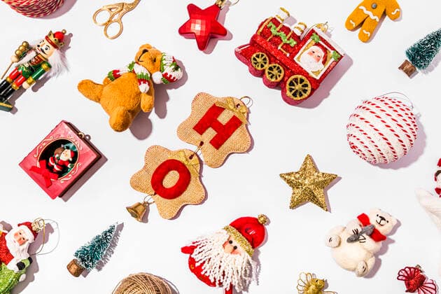 Collection of various Christmas decorations flat laid against white background FLMF00542