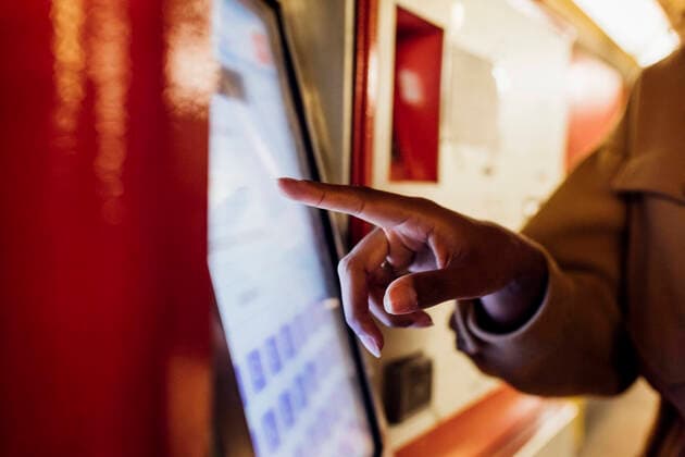 Woman using ticket machine at subway station model released Symbolfoto MEUF03529