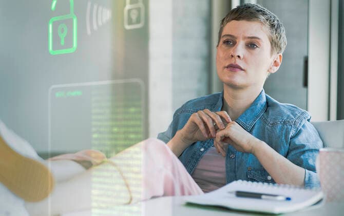 Businesswoman looking at data security system at office model released Symbolfoto property released UUF23645