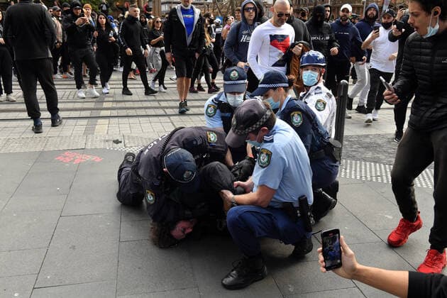 ANTI LOCKDOWN PROTEST SYDNEY, A protester is arrested by police at Sydney Town Hall during the ?World Wide Rally For Freedom? anti-lockdown rally at Hyde Park in Sydney, Saturday, July 24, 2021. ( NO ARCHIVING, EDITORIAL USE ONLY, NO USE IN BOOKS WITHOUT CONSENT SYDNEY NSW AUSTRALIA  Copyright: xMICKxTSIKASx 20210724001559665257
