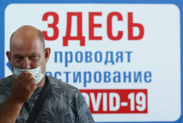 IVANOVO, RUSSIA - JULY 27, 2021: A man is seen at a mobile COVID-19 vaccination center at a railway station. A sign reads Here you can get tested for COVID. Vladimir Smirnov TASS  TS109CCA