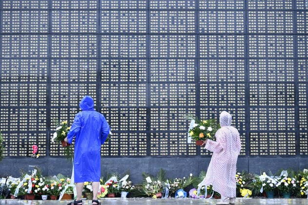(210728) -- TANGSHAN, July 28, 2021 -- People mourn for victims in the 1976 Tangshan earthquake at the Tangshan Earthquake Memorial Park in north China s Hebei Province, July 27, 2021. Wednesday marks the 45th anniversary of the Tangshan earthquake. The 7.8-magnitude quake struck the city of Tangshan in Hebei Province on July 28, 1976, killing more than 240,000 people and destroying virtually all buildings. ) CHINA-HEBEI-TANGSHAN EARTHQUAKE-45TH ANNIVERSARY (CN) MuxYu 