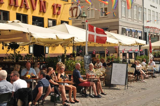 Copenhagen, Denmark. 28 July 2021, Food & travel and baot crusing and food and drinks tourism on summer heat day on Nyhavn canal in danish capital. (Photo..Francis Joseph Dean Dean Pictures)