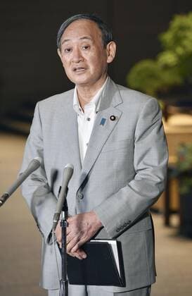 Japan PM Suga Japanese Prime Minister Yoshihide Suga meets the press at his office in Tokyo on July 29, 2021, as the country s daily total of COVID-19 cases topped 10,000 for the first time the same day. Suga denied any linkage between rampant coronavirus infections in Japan and the ongoing Tokyo Olympics.  A14AA0000755086P