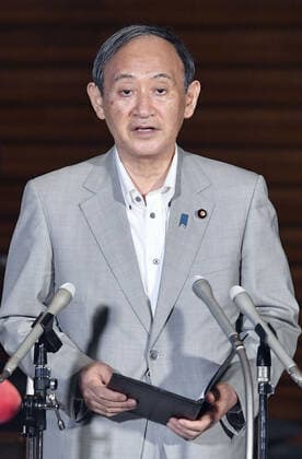 Japan PM Suga Japanese Prime Minister Yoshihide Suga meets the press at his office in Tokyo on July 29, 2021, as the country s daily total of COVID-19 cases topped 10,000 for the first time the same day. Suga denied any linkage between rampant coronavirus infections in Japan and the ongoing Tokyo Olympics.  A14AA0000755087P