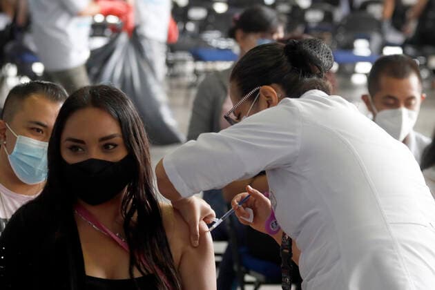 Youths Receive Sputnik V Vaccine Against Covid-19 A Health worker, applies a Sputnik V dose to a young inside at the Palacio de los Deportes during the mass vaccination against Covid 19 for people aged 18 on July 28, 2021 in Mexico City, Mexico. Mexico City Mexico group-youthsre210728_npXHJ  Copyright: xEyepixx