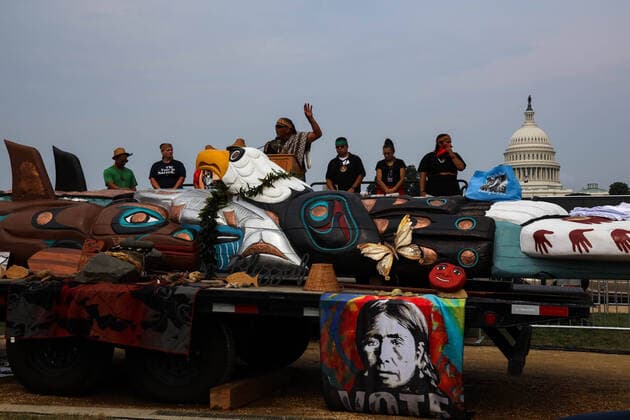 Indigenous Blessing Ceremony And Rally In Washington, D.C. A man speaks beyond a totem pole during a rally on the National Mall in Washington, D.C. on July 29, 2021 to draw attention and action to sacred sites and Indigenous rights Washington D.C. United States dozier-indigeno210729_npGuk  Copyright: xBryanxOlinxDozierx