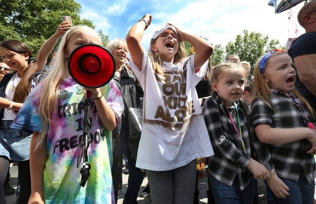 July 31, 2021, London, United Kingdom: A protester shouts for freedom through a megaphone during the demonstration..Children and their parents protest in Central London against continued Covid-19 restrictions and vaccination of children. London United Kingdom - ZUMAs197 20210731_zaa_s197_266 Copyright: xMartinxPopex
