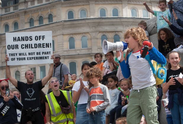July 31, 2021, London, United Kingdom: A child speaks on a megaphone during the demonstration in Trafalgar Square..Children and their parents protest in Central London against continued Covid-19 restrictions and vaccination of children. London United Kingdom - ZUMAs197 20210731_zaa_s197_277 Copyright: xMartinxPopex