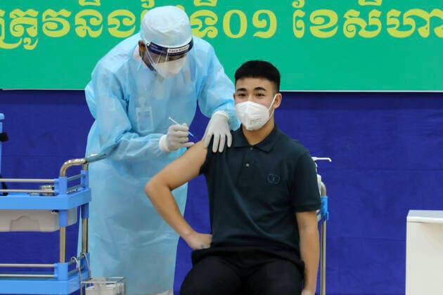 (210801) -- PHNOM PENH, Aug. 1, 2021 -- An adolescent receives his first dose of Sinovac COVID-19 vaccine in Phnom Penh, Cambodia, Aug. 1, 2021. Cambodia on Sunday launched an anti-COVID-19 vaccination drive for adolescents aged from 12 to 17, with China s Sinovac vaccine. (Photo by Xinhua) CAMBODIA-PHNOM PENH-COVID-19-VACCINATION-ADOLESCENTS LyxLay 