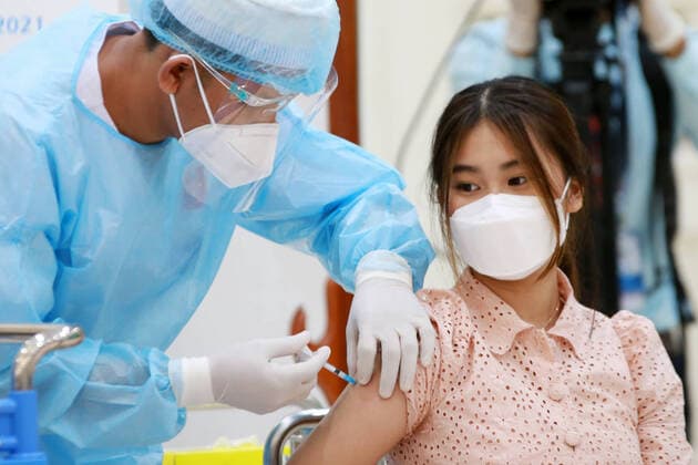 (210801) -- PHNOM PENH, Aug. 1, 2021 -- An adolescent receives her first dose of Sinovac COVID-19 vaccine in Phnom Penh, Cambodia, Aug. 1, 2021. Cambodia on Sunday launched an anti-COVID-19 vaccination drive for adolescents aged from 12 to 17, with China s Sinovac vaccine. (Photo by Xinhua) CAMBODIA-PHNOM PENH-COVID-19-VACCINATION-ADOLESCENTS LyxLay 